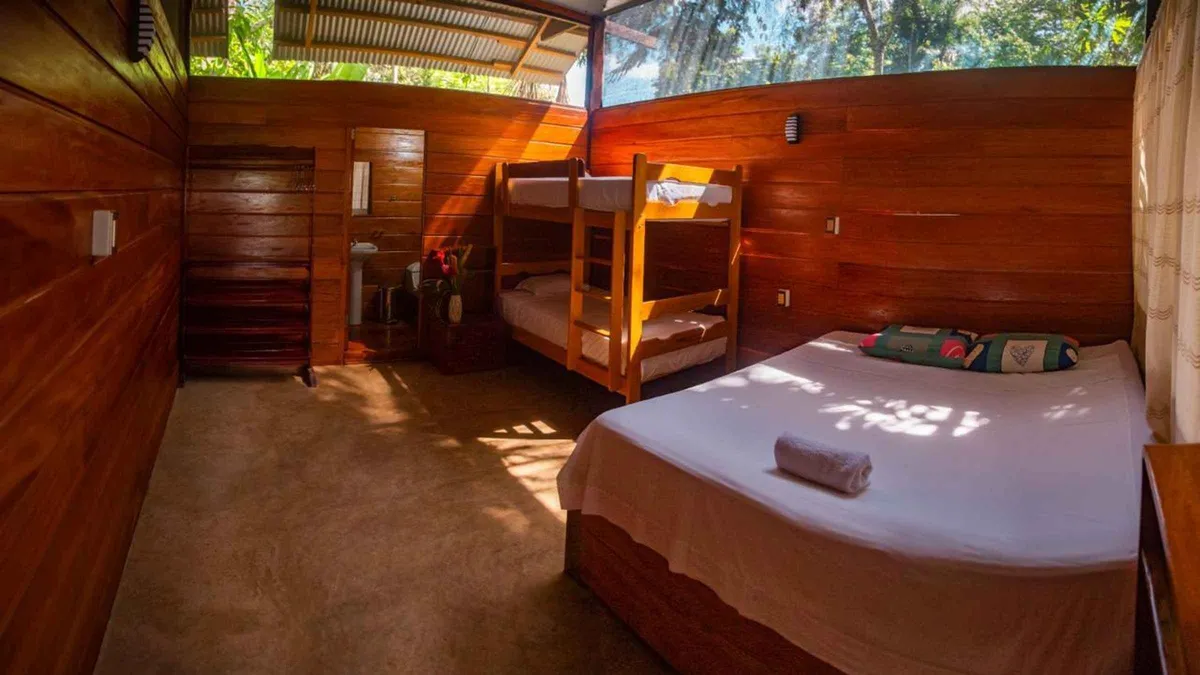 Jungle lodge cabin above the Tambopata River at dusk on a 2-day wildlife tour from Puerto Maldonado, Peru